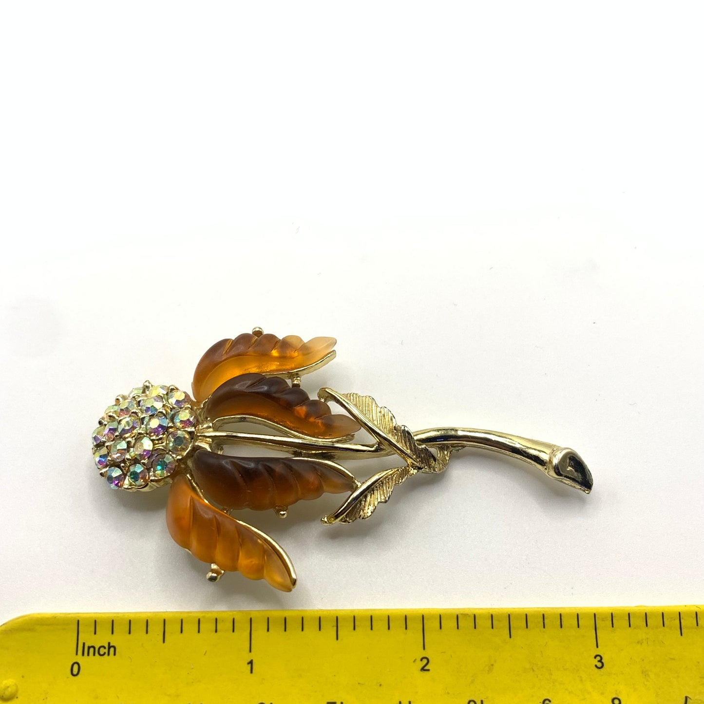 Vintage unsigned amber tone and AB rhinestone Thermoset flower brooch