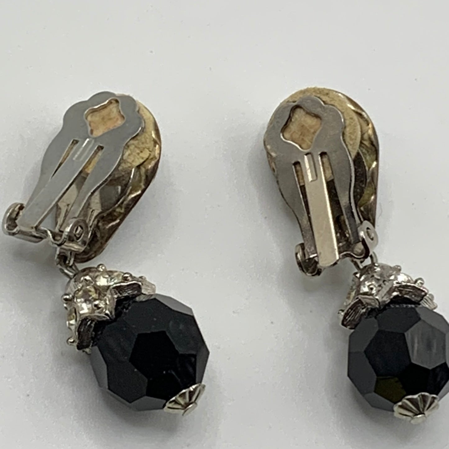 Vintage unsigned silver tone jet black glass and clear rhinestone dangle clip on earrings