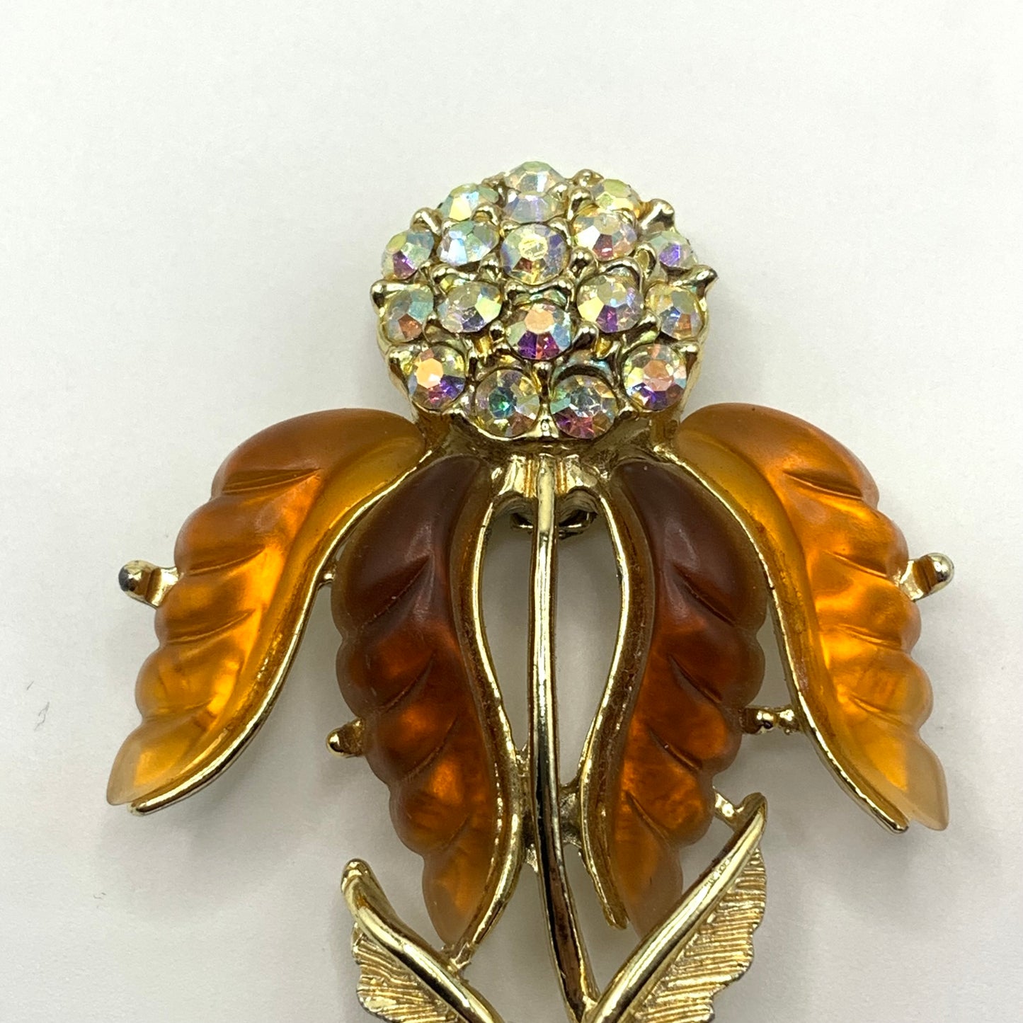 Vintage unsigned amber tone and AB rhinestone Thermoset flower brooch