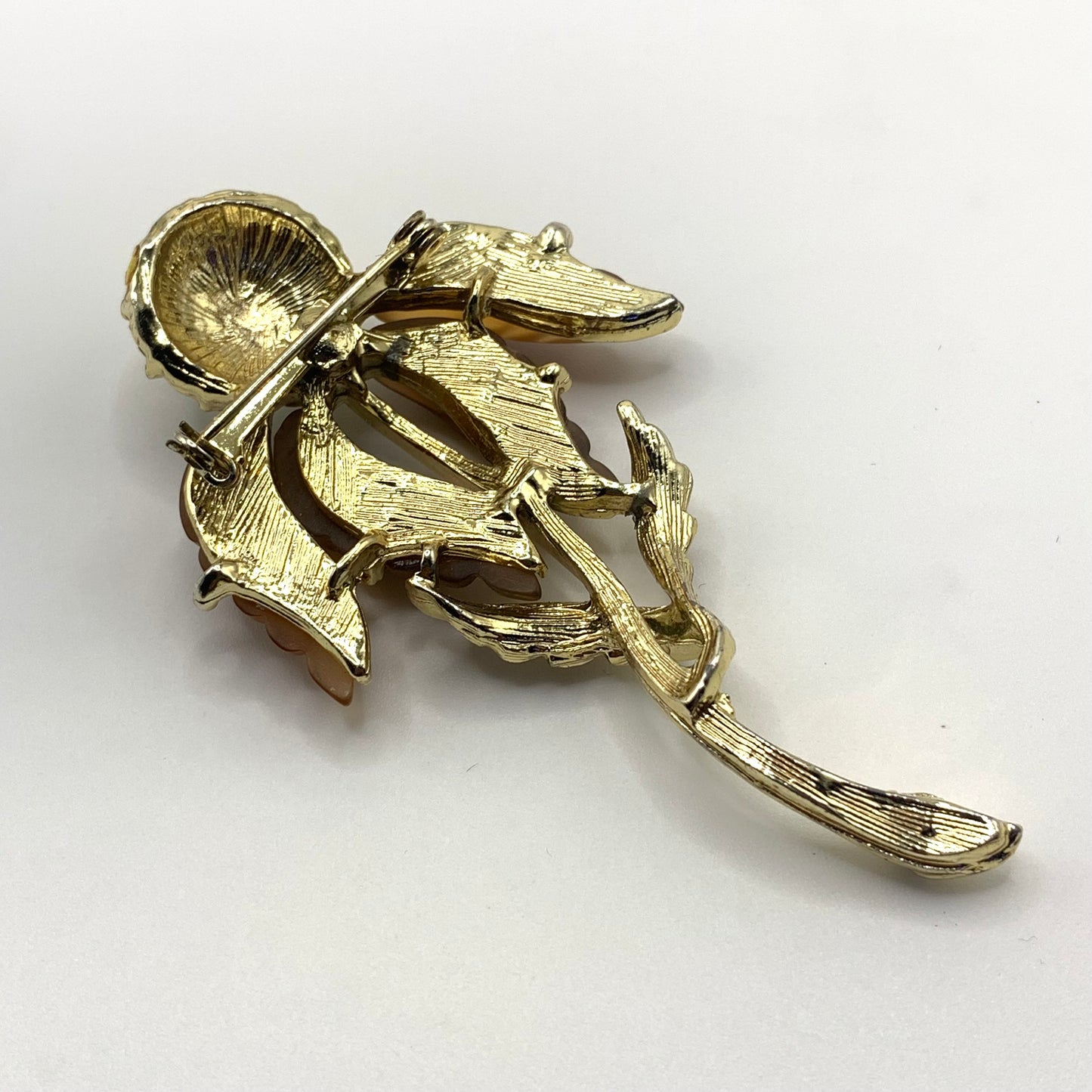 Vintage unsigned amber tone and AB rhinestone Thermoset flower brooch