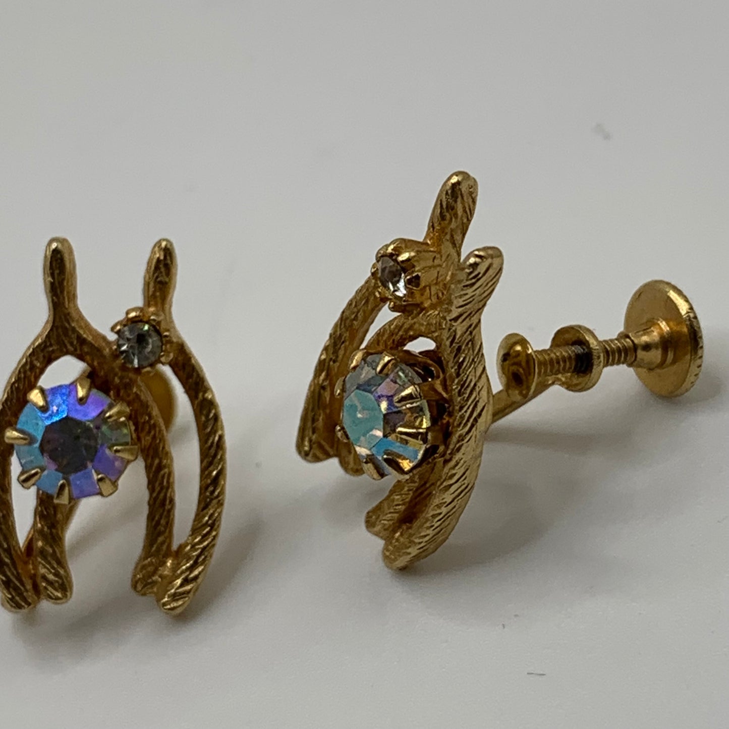 Vintage unsigned Textured gold tone double wishbone AB rhinestone screw back earrings
