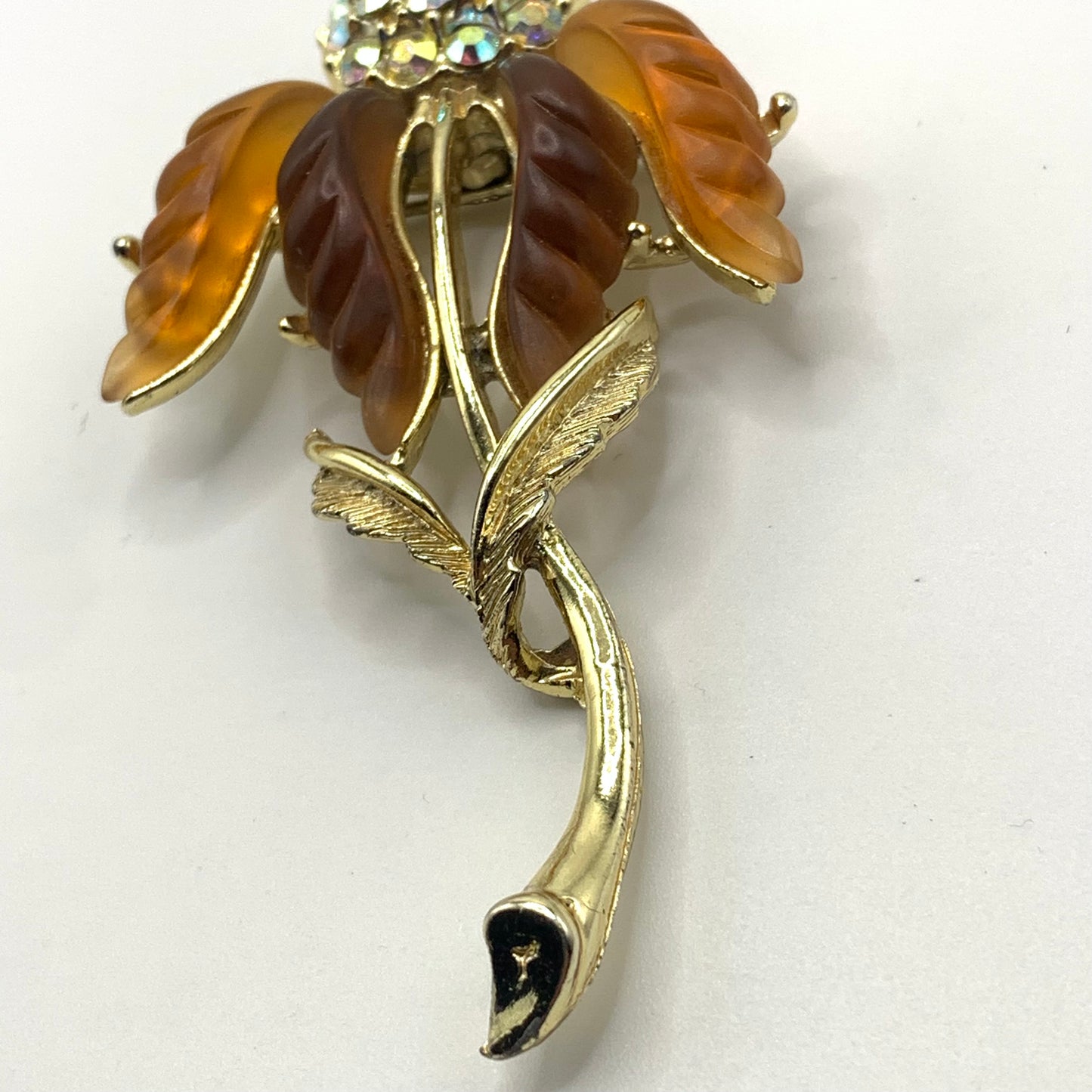 Vintage unsigned amber tone and AB rhinestone Thermoset flower brooch