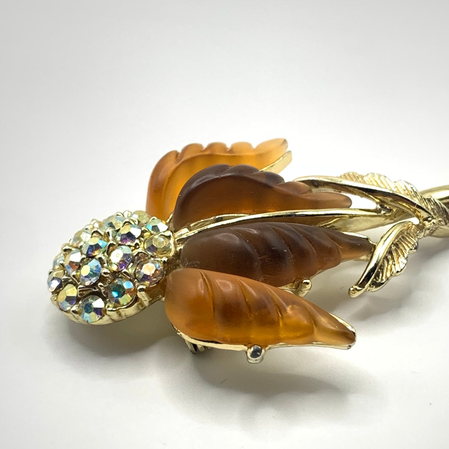 Vintage unsigned amber tone and AB rhinestone Thermoset flower brooch