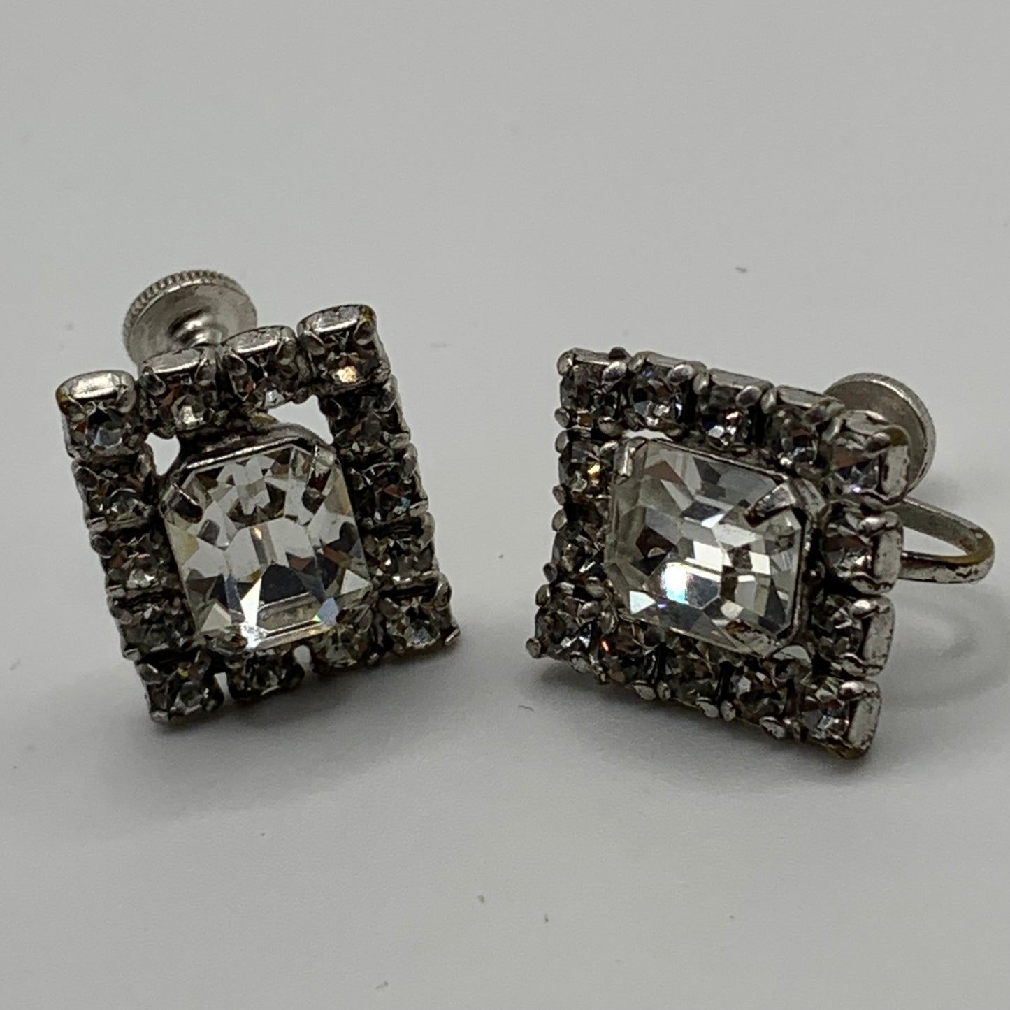 Vintage unsigned chromium plated clear rhinestone screw back earrings