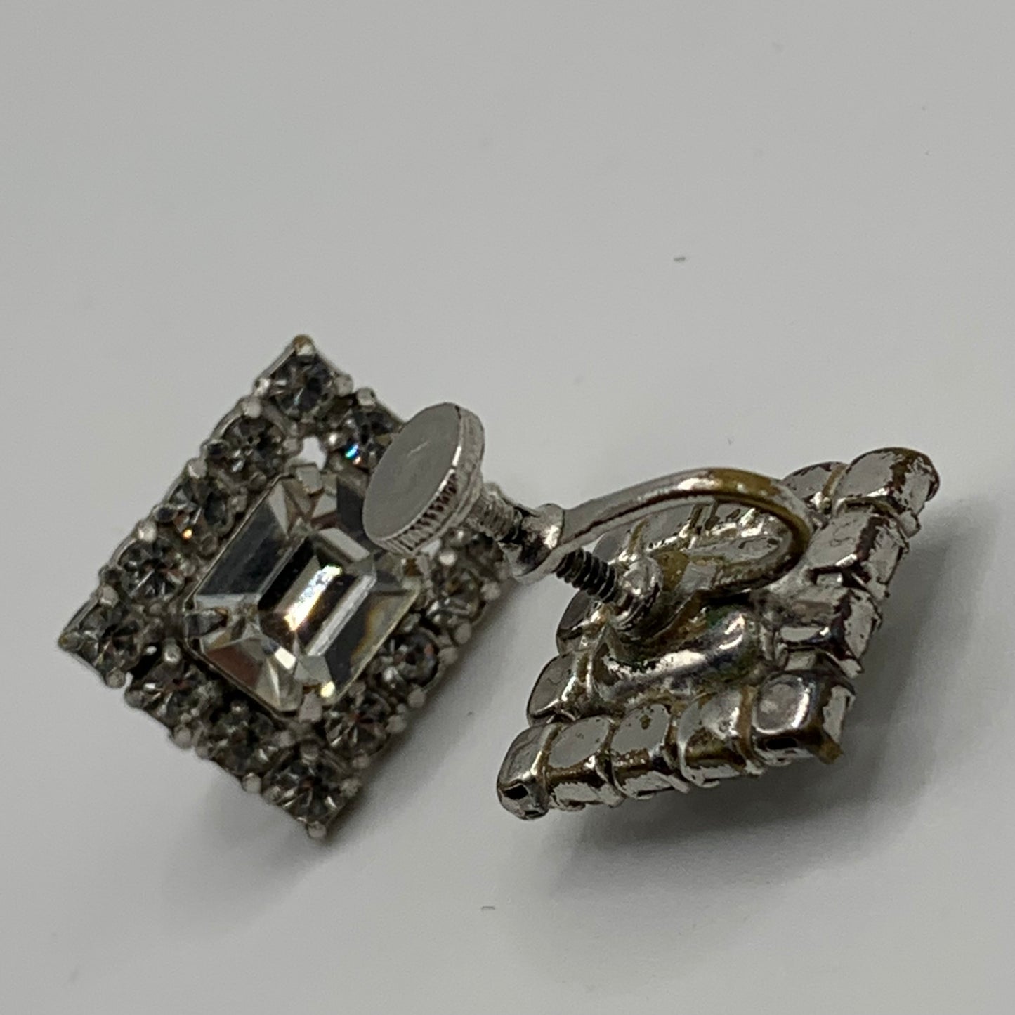 Vintage unsigned chromium plated clear rhinestone screw back earrings